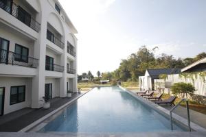 a swimming pool in the middle of a building at Northerly นอร์ทเทอร์ลี่ in Chiang Rai