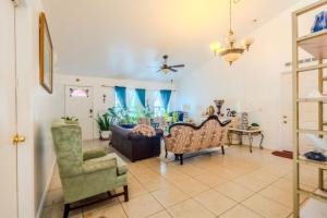 a living room with a couch and chairs at Flint and Kingscrest, LLC - Private Rooms in Shared Home in Orlando +21 photos