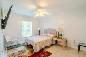 a bedroom with a bed and a ceiling fan at Flint and Kingscrest, LLC - Private Rooms in Shared Home in Orlando
