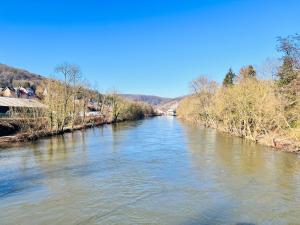 a view of a river from a bridge at Riverside Cabin Surrounded by Nature for Two in Esneux