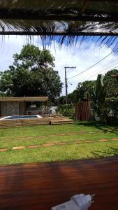 a view of a yard with a pavilion withgrass at Recanto dos Coraiss in Marau