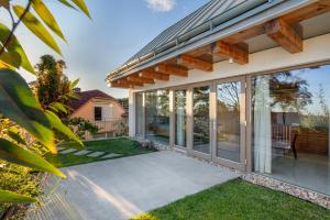 an internal view of a house with sliding glass doors at GG3 guesthouse in Eger