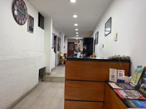 a room with a counter and a hallway at Chilhotel en Providencia in Santiago