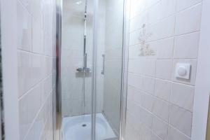 a shower with a glass door in a bathroom at Les Eaux Vives in Sévrier +64 photos