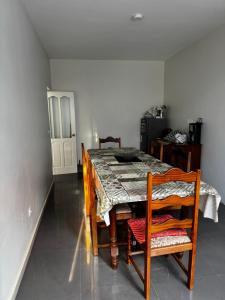 a dining room with a table and two chairs and a table and chairsktop at Cozy Home with Terrace Views! in Ponta do Sol +23 photos