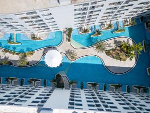 an aerial view of the pool at a resort at Capri Residence Bangtao in Bang Tao Beach