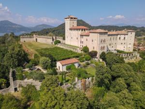 an aerial view of a castle on a hill at Tra la Rocca e il Lago in Angera