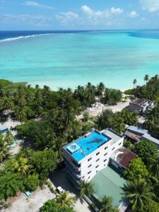 an aerial view of the resort and the ocean at La Pearl Mathiveri in Mathiveri