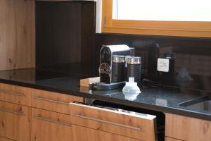 a kitchen with a coffee maker on a counter at Haus Panorama in Schwarzsee