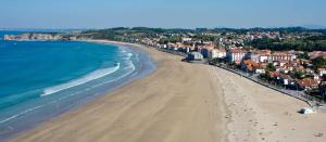 an aerial view of a beach with buildings and the ocean at Bigarena in Hendaye
