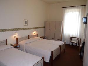 Postel nebo postele na pokoji v ubytování Hotel Giardinetto