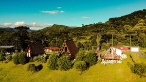 an aerial view of a village with houses and trees at Estância Nazari in Urubici