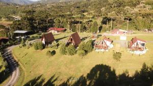 an aerial view of a house on a grassy field at Estância Nazari in Urubici