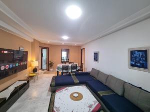 a living room with a couch and a table at Luxury home tunisia mall lac 2 in Tunis
