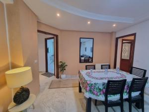 a dining room with a table and chairs at Luxury home tunisia mall lac 2 in Tunis