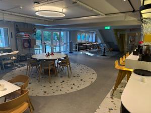 a restaurant with tables and chairs in a room at Splendid view Sinaia in Sinaia