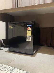 a microwave oven sitting on a shelf in a room at KB MARINA PARk in Chennai +70 photos