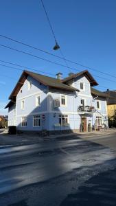 a large white building on the side of a street at rooms11 in Salzburg