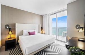 a bedroom with a large bed and a large window at Hyde house 3507 AL MAR in Hollywood +20 photos