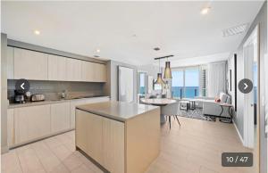 a kitchen and living room with a view of the ocean at Hyde house 3507 AL MAR in Hollywood
