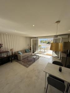 a living room with a couch and a table at Atidos vakantie appartementen in Ontinyent +92 photos