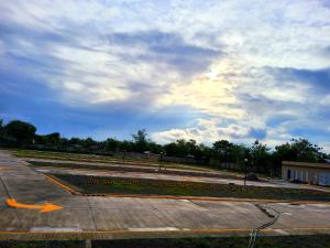 a park with a bunch of flowers in a parking lot at RnB Stayction in Lapu Lapu City