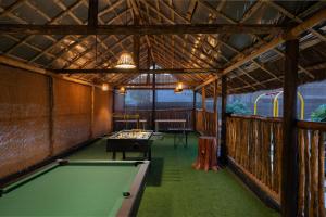 a billiard room with a pool table in it at Punarjeevani Ayurvedic Heritage in Vythiri