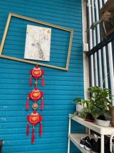 a blue wall with red ribbons hanging on it at 沐光森野 一同永續旅行 中小型寵物友善 親子友善 in Wujie +29 photos