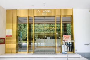 a hotel front door of a building at A Hotel Bugis in Singapore