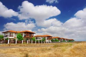 a row of houses on the side of a road at Villa Jasmin in Aheloy +9 photos