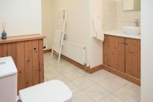 a bathroom with a toilet and a sink at Dukes Well in Congleton +40 photos