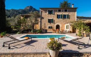 an external view of a house with a swimming pool at Frontera in Sóller