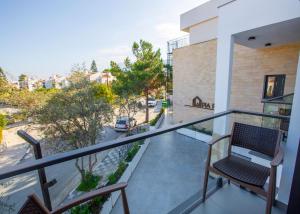 a balcony with a bench and a street at Mediterrian Business Suites by HolidayKeys in Kyrenia