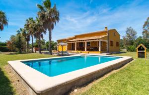 a swimming pool in front of a house at Can Jaume Pollenca in Pollença
