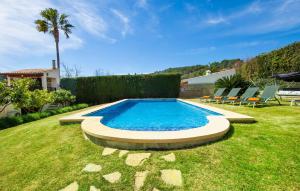 a swimming pool in the middle of a yard at Ca Na Rosa De Selva in El Port de la Selva