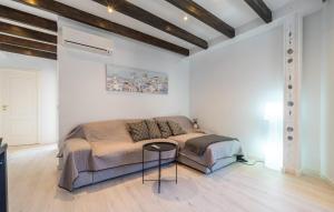 a bedroom with a bed and a table in it at Can Roses in Moscari