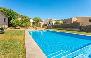 a swimming pool in the yard of a house at Turixant Dalt in El Port de la Selva