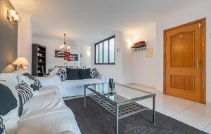 a living room with a white couch and a glass table at Atico Roger De Flor in Port de Pollensa +36 photos