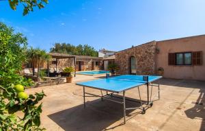 a ping pong table in the backyard of a house at S'hortet in Campos