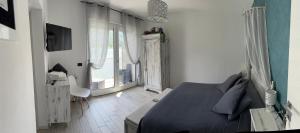 a bedroom with a bed and a desk and a window at Adeline in Dascio +181 photos
