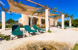 a group of chairs and a table on a patio at Can Carrio in Son Servera