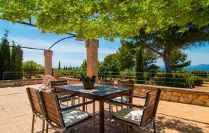 a table and chairs sitting on a patio at Villa Maria De Betlem in Colonia de Sant Pere