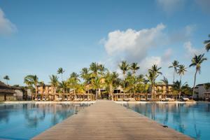 a wooden bridge over a pool at a resort at JAZ Elite Aurora in Michamvi +64 photos