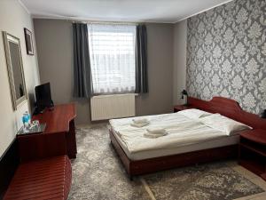 Llit o llits en una habitació de Hotel Ava