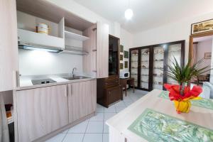 a kitchen with a sink and a counter top at Casa Wanda IL MIRTO in Oristano