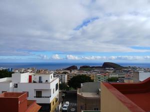 a view of the ocean from a city at ATICO ACOGEDOR LA LAGUNa in Las Lagunas