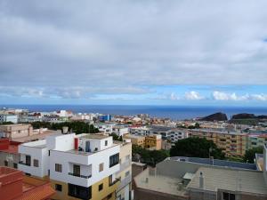 a city with buildings and the ocean in the background at ATICO ACOGEDOR LA LAGUNa in Las Lagunas +3 photos