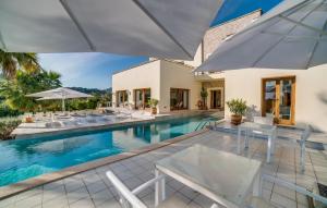 an image of a swimming pool with chairs and umbrellas at Son Sard Nou in Son Servera +44 photos