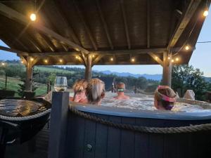 a group of people in a hot tub at Góralski Przystanek Jacuzzi & sauna - dom dla 17 osób in Biały Dunajec
