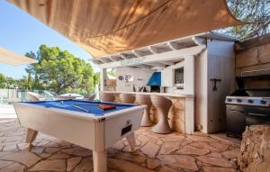 a pool table on a patio with a bar at Ocean View in Palma de Mallorca